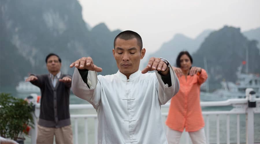 Taichi exercise in early morning in Halong Bay