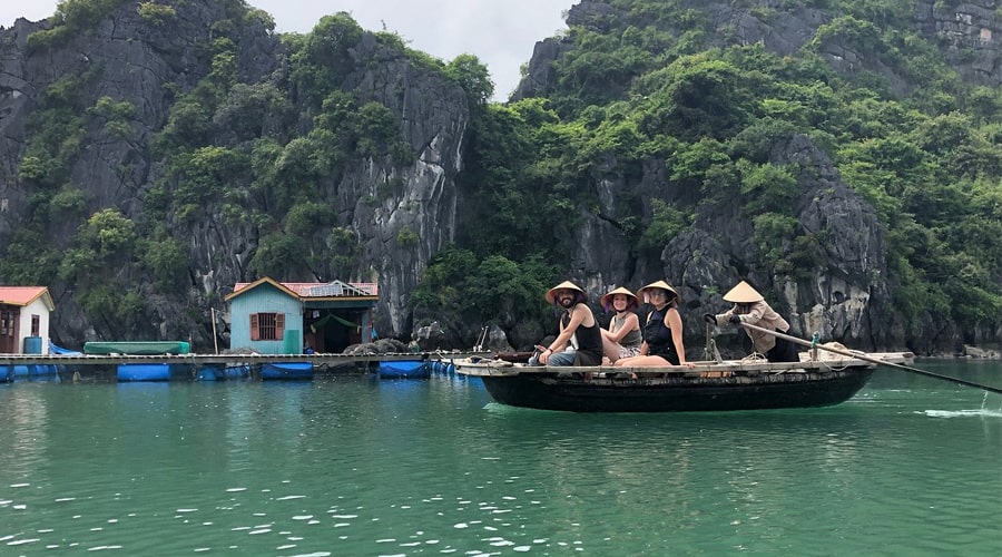 visiting floating village by bamboo boat