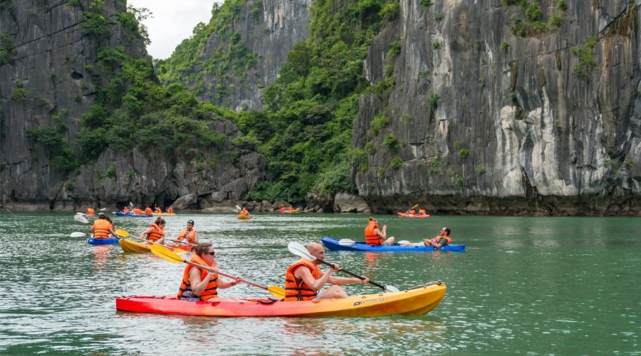 Kayaking in a lake inside Dark and Light cave